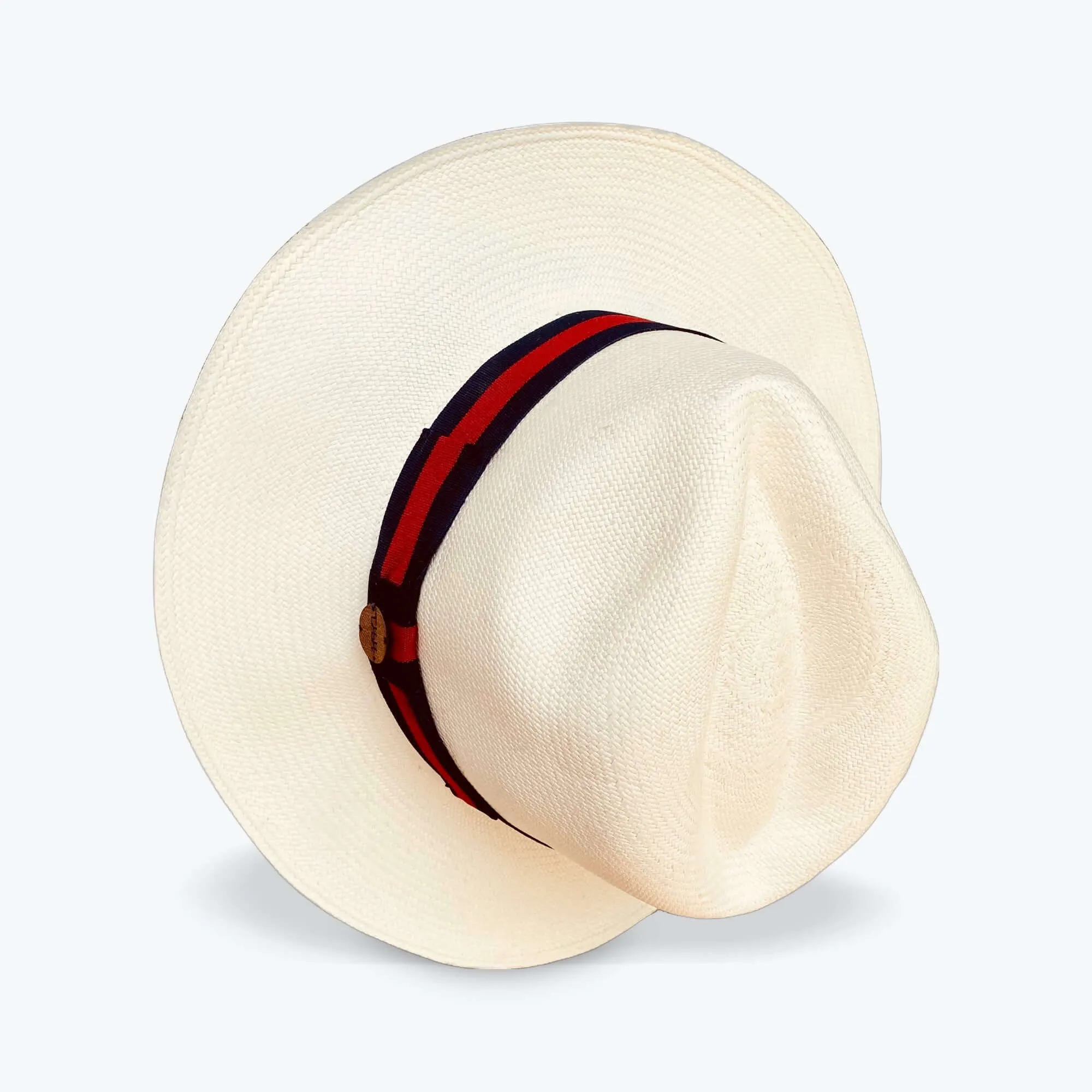 CLASSIC FEDORA STRAW HAT WITH A BLUE AND RED HAT BAND